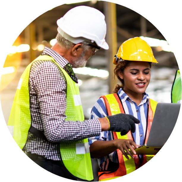 Two construction people talking with laptop