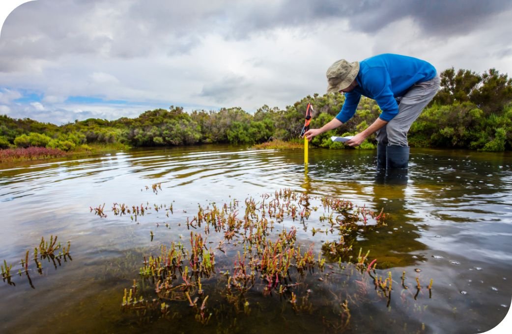 Person testing body of water